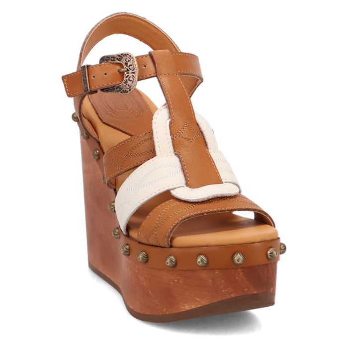 Brown wedge sandal with decorative strap and studs on a white background