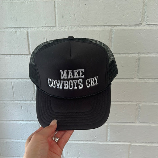 Black trucker cap with "Make Cowboys Cry" Embroidered on the front panel.