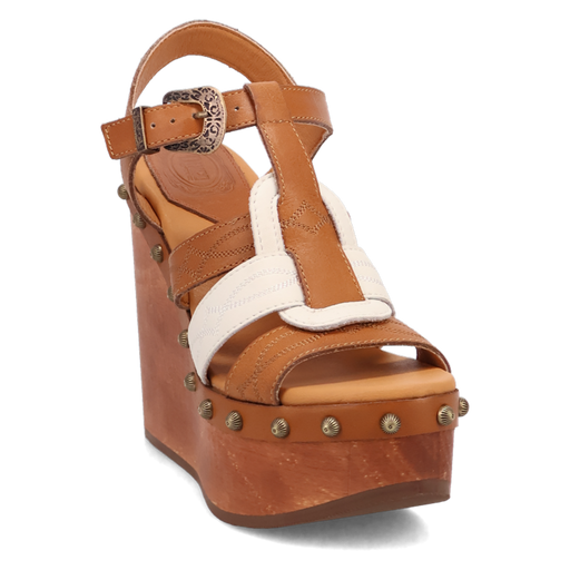 Brown wedge sandal with decorative strap and studs on a white background