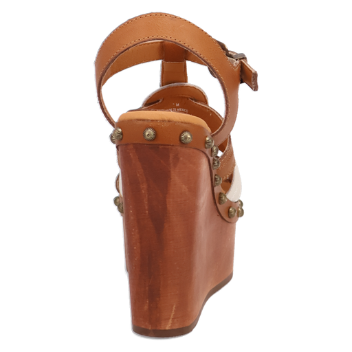 Brown wedge sandal with strap and decorative studs on a white background