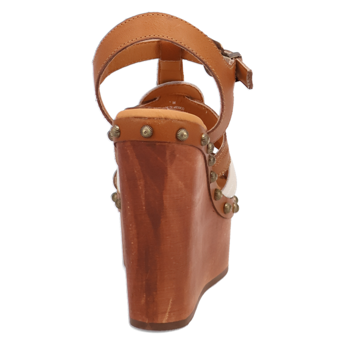 Brown wedge sandal with strap and decorative studs on a white background