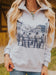 Person wearing a gray hoodie with a graphic design of cowboys and a barn.