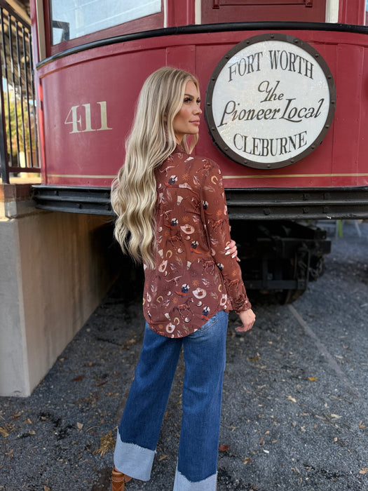 Woman standing in front of a red trolley with a sign reading 'Fort Worth The Pioneer Local Cleburne'.