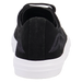Black slip-on sneaker with white sole on a white background
